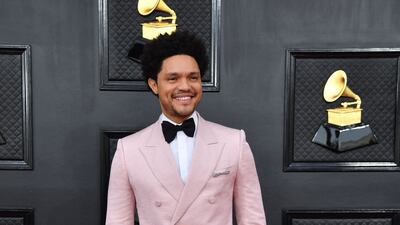 Trevor Noah, wearing a pink tuxedo jacket. AFP