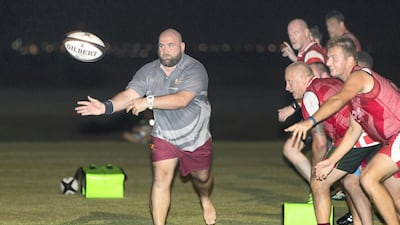 Craig Chapman, left, coaching RAK Rugby players at Tower Links Golf Club in Ras Al Khamiah. Christopher Pike / The National