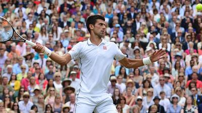 Novak Djokovic returns a shot during the 2014 Wimbledon final, which he won. Carl Court / AFP / July 6, 2014