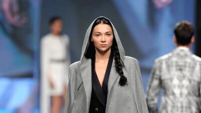 The standout was a grey hooded cape that created a tension between edge and elegance. Courtesy Getty Images