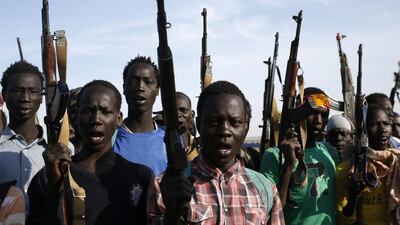 Jikany Nuer White Army fighters brandish their weapons in Upper Nile State on February 10, 2014. South Sudan has been in turmoil since December 15, 2013, when a dispute within the army sparked fierce fighting in the capital city, Juba. Fighting spread quickly across the country and soon took on an ethnic dimension after president Salva Kiir alleged that his former vice-president, Riek Machar, was planning a coup. The fighting has pitted army forces loyal to Kiir, who is a member of the Dinka tribe, against rebel forces aligned to Machar, a member of the Nuer tribe. The Dinka tribe is the largest in South Sudan; the Nuer is the second largest and boasts a deadly tribal militia known as the ‘White Army’ because its fighters rub white ash, extracted from burnt cow dung, over their bodies. The White Army’s main role in the community historically has been to raid cattle and protect the community, but recently it has transformed into a militia used for political gain. The White Army is allegedly responsible for a January 27, 2014, attack — four days after a ceasefire was signed — that left at least 15 people dead. Goran Tomasevic / Reuters