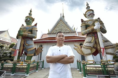 Portrait of Hartanto Gunawan, standing in front of the famous Guardian Giant statues at Wat Arun (Temple of Dawn). Sasamon Rattanalangkarn for The National