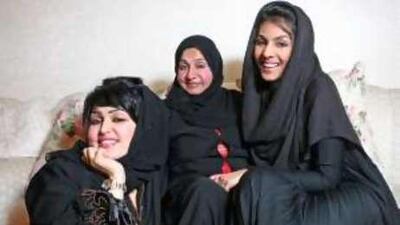 Ameera al Shamsi (left), her sister Fatma Alawi (right) and their mother, Samia al Yousuf, at home in Dubai. The sisters say they are lucky to have such a positive role model in their mother.