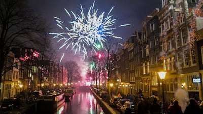 Fireworks explode at Bloemgracht during New Year celebrations in the centre of Amsterdam. A year overshadowed by the coronavirus pandemic will not go out with the usual bang in the Netherlands after the Dutch government announced that it is banning the sale and use of most fireworks in 2020. AP Photo