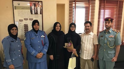 The 21-year-old woman and her father are taken for a tour around Al Hamidiya Police station in Ajman. Ajman Police