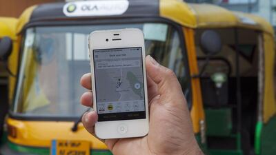 Above, the ride-hailing app Ola. Namas Bhojani / Bloomberg