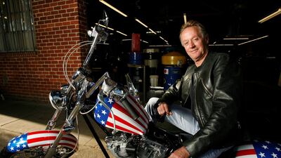 Fonda poses for a portrait on a replica of the "Captain America" bike from 'Easy Rider' in Glendale, California on October 23, 2009. Reuters.