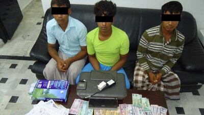 The Criminal Investigation Department at Sharjah Police said they arrested MOA, MBL and MKA and seized the tools they used to make counterfeit money at their home in a farm in Al Latheeth, where they worked. Courtesy Sharjah Police