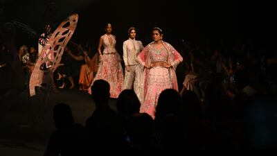 Models present creations by designer Suneet Varma.