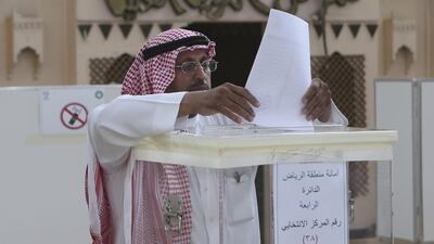 A Saudi Arabian man casts his ballot during the municipal elections in Riyadh on December 12. Khalid Mohammed/AP