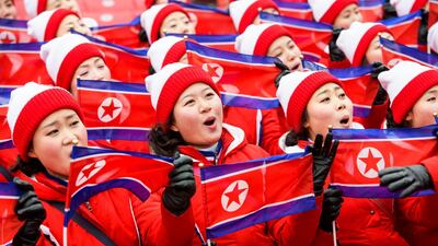 Members of the North Korean delegation wave flags as they wait for the start of the Women's Slalom race at the Yongpyong Alpine Centre during the PyeongChang 2018 Olympic Games, South Korea. The women's slalom race is being cancelled due to weather conditions. Jean-Christophe Bott / EPA