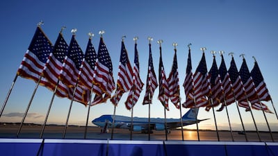 Air Force One is prepared for President Donald Trump as flags fly on a stage at Andrews Air Force Base. AP Photo