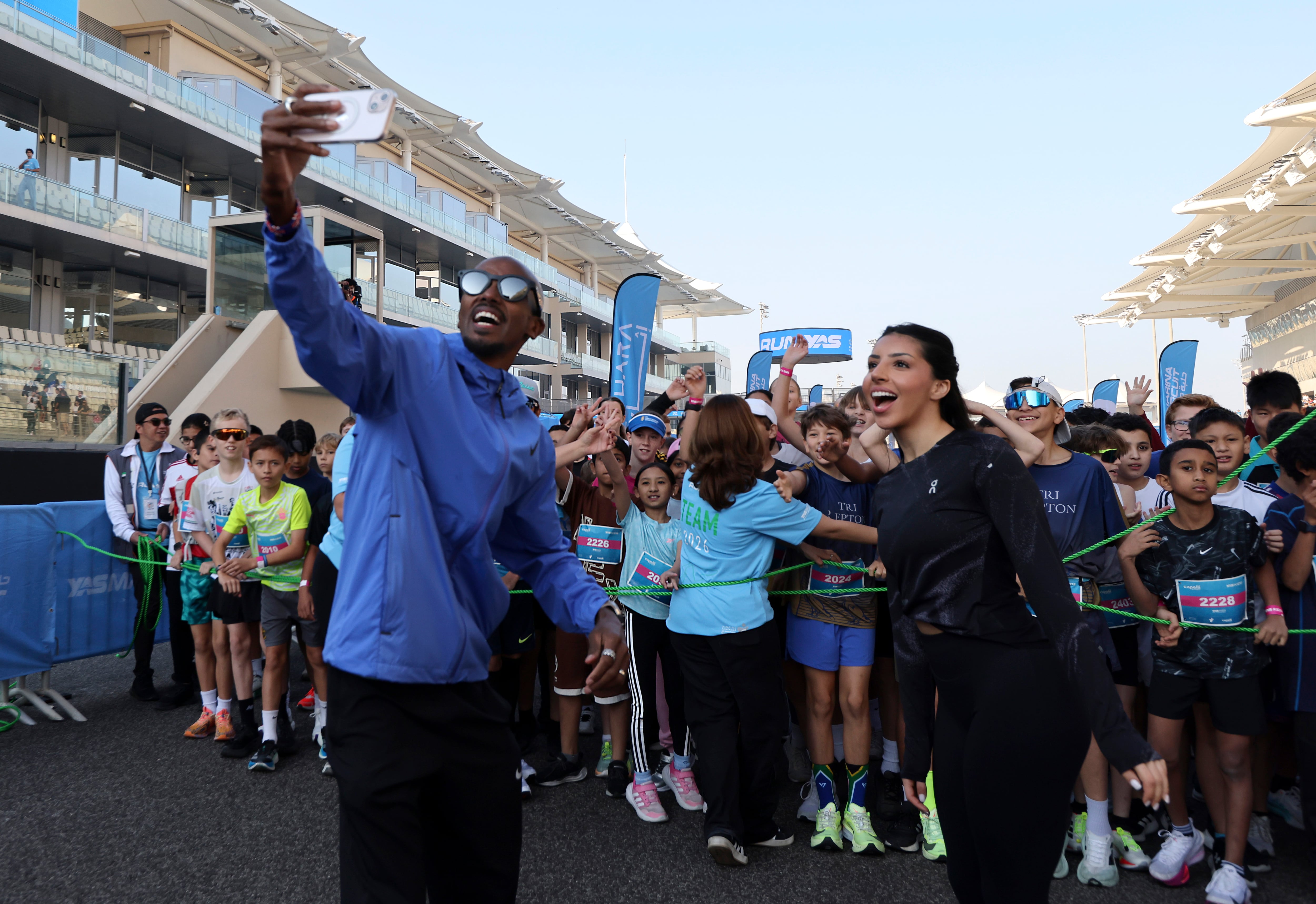 UAE athlete Maryam Al Farsi and Olympic legend Mo Farah during RunYas 2026 in Abu Dhabi. All images Victor Besa / The National