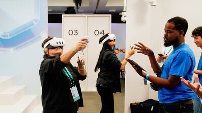 People test out the Meta Quest 3 in a demonstration room at the Connect conference in Menlo Park, California. AP
