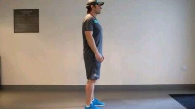 1. Stand with your feet shoulder-width apart. Razan Alzayani / The National. Razan Alzayani / The National