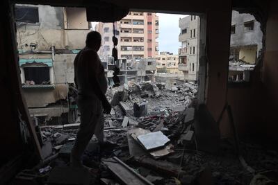 A Palestinian man inspects the damage after a June 8 operation by Israeli forces in Gaza's Nuseirat camp. The US State Department's press statement on the rescue of four Israeli hostages failed to mention Palestinian casualties entirely. AFP