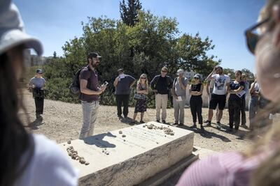 Ido Even-Paz speaks at the grave of American Israeli Jewish settler Baruch Goldstein who killed 29 Palestinians and wounded 125 during the 1994 massacre at the Cave of the Patriarchs. Photo by Heidi Levine for The National