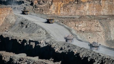 Mining trucks carry diamond bearing rock ore, also known as kimberlite, from the open pit at the Letseng diamond mine. Waldo Swiegers / Bloomberg