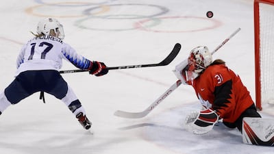 Jocelyne Lamoureux of the US (L) misses a penalty shot against Canada goalkeeper Genevieve Lacasse in the Women Preliminary Round Match - US v Canada. David W Cerny / Reuters