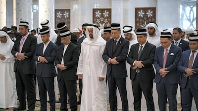 Sheikh Mohamed bin Zayed and Sultan Abdullah, attend Friday prayers at Sheikh Zayed Grand Mosque.
