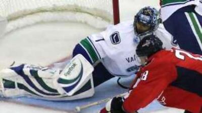 The Washington Capitals' Alexander Semin scores a goal against the Vancouver Canucks.