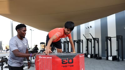 Ayaan trains with his coach, Ceejay Bollo, to build strength and endurance at Wellfit gym in Meydan, Dubai. Chris Whiteoak / The National