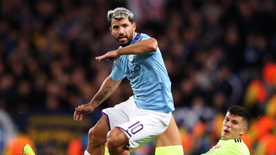 Manchester City striker Sergio Aguero escapes the challenge of Dino Peric. Getty Images