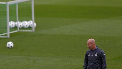 Real Madrid manager Zinedine Zidane looks at his players during training. Francisco Seco / AP Photo