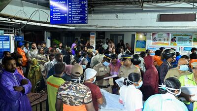 Family members gather to identify victims who died after a landslide, in a health centre at Meppadi in Kerala's Wayanad district. AFP