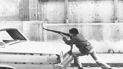 A man aiming a rifle in Beirut in December 1975, the year Lebanon's 15-year civil war began. Getty