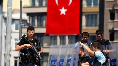 Turkish police stand guard at the entrance of Gezi Park at Istanbul’s Taksim Square, where 441 people were detained on Sunday.