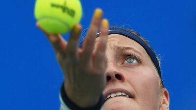 2014 Wimbledon winner Petra Kvitova lofts the ball to serve on Thursday in her quarter-final win over Caroline Garcia at the WTA Wuhan Open. Greg Baker / AFP / September 25, 2014