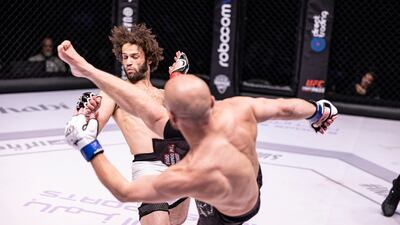 Ahmed Faress of Egypt avoids a high kick from South African Cedric Doyle.