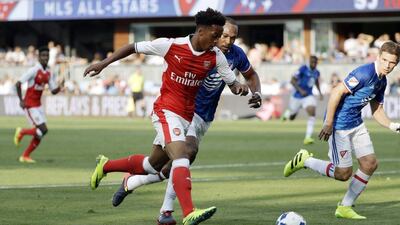 Arsenal midfielder Christopher Willock, centre, dribbles past MLS All-Stars defender Kendall Waston, rear, of the Vancouver Whitecaps, during the second half of the MLS All-Star game Thursday, July 28, 2016, in San Jose, California. Marcio Jose Sanchez / AP Photo