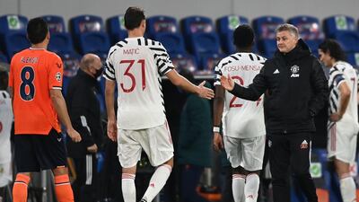 Coach Ole Gunnar Solskjaer shakes hands with Nemanja Maticat. AFP