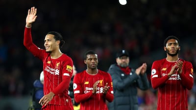 Virgil van Dijk, Georginio Wijnaldum and Joe Gomez of Liverpool show their appreciation to the fans. Getty