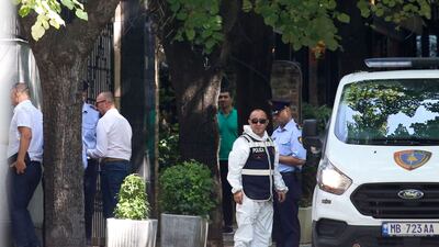 Albanian police officials gather outside the Iranian embassy in Tirana on Friday. AFP