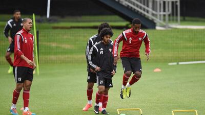 Defender Abdulaziz Haikal, right, displays his jumping ability.