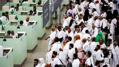 Muslim worshippers queue for immigration and passport control at the Hajj terminal of the King Abdulaziz international airport in Jeddah. About 2.6 million Muslims are expected to attend this year's Hajj pilgrimage. Mast Irham / EPA