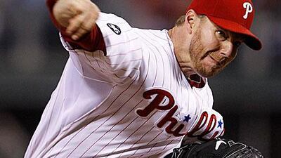 Philadelphia Phillies starting pitcher Roy Halladay delivers to a Cincinnati Reds batter during the fifth inning.