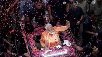 Indian Prime Minister Narendra Modi waves to supporters while campaigning in Varanasi on April 25, 2019. Reuters