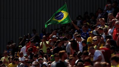 Fans wave a Brazil flag far, far away from the South American country - in Liverpool - during a friendly last week. Andrew Boyers / Reuters