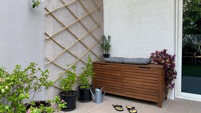 A storage chest doubles up into a seat where one can sit and enjoy the view