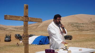 Father Hani Tawk, a Maronite Christian priest, celebrates mass on Qornet Al Sawda, a mountain in northern Lebanon, on August 9, 2020. Photos by Aram Abdo