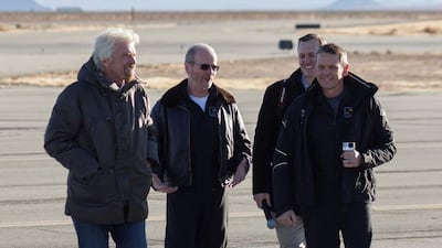 Richard Branson, pilot David McKay, George Whitesides, president of Virgin Galactic, and pilot Mark Stuckey speak as Virgin Galactic's SpaceShipTwo, dubbed the VSS Unity completed its first ever free-flight test. Kenneth Brown / Reuters