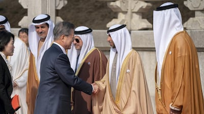 Mr Moon greets Suhail Al Mazrouei, Minister of Energy during a reception, at the Blue House. Ryan Carter / Ministry of Presidential Affairs