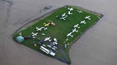 Floodwaters engulf aircraft parked at an airport in Lismore, Australia. The Wilsons river breached its banks March 31, 2017, resulting in flooding in the remote far-north New South Wales town. Dave Hunt / EPA