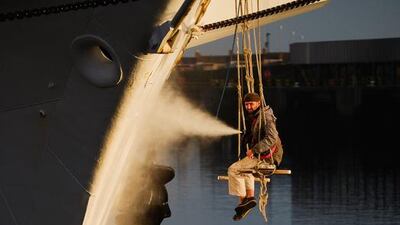A crew member washes the hull of the Polish ship, Dar Mlodziezy during the North Sea Tall Ships Regatta in Blyth, England. The bustling port town in South East Northumberland played host to the four-day long prestigious regatta. Ian Forsyth / Getty Images