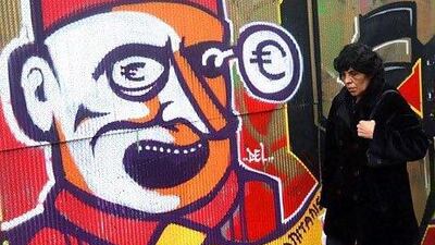 Greece has vowed to tackle the debt crisis that has shaken the euro-zone region. Above, a graffiti in Athens protesting capitalism. Orestis Panagiotou / EPA