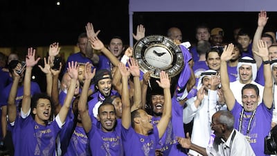 Al Ain celebrate with the Arabian Gulf League trophy after winning the league in May. Jeffrey E Biteng / The National / May 9, 2015